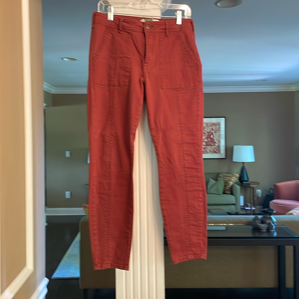 Anthropology rust colored utility style jeans